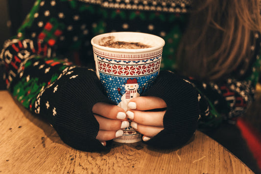 close-up-of-hands-holding-christmas-cup