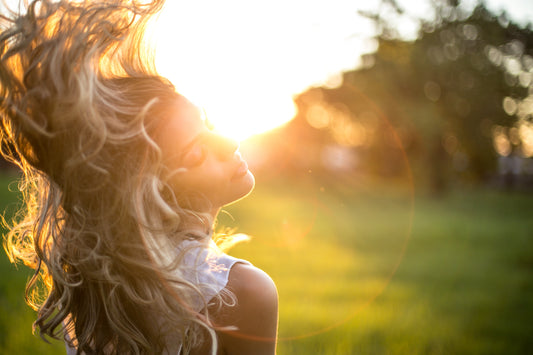 selective-focus-photography-of-woman-hair-sunset